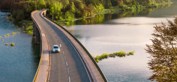 winding road with single car